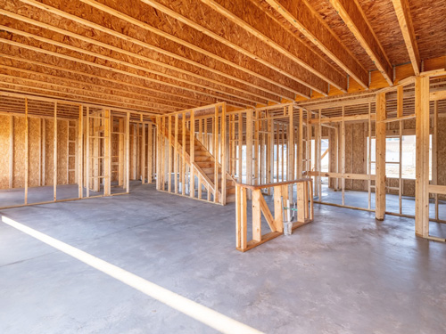 Interior view of a building with exposed wooden framing, showcasing Peak Environmental's expertise in safe and efficient demolition services in Denver and The Front Range.